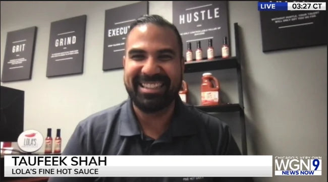 A smiling man featured in an article from Lola's Fine Sauces.