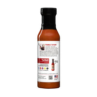 Lola's Buffa-Lola Wing Sauce: A bottle of hot sauce with a buttery fusion of peppers and red jalapeños. Perfect for wings, pizza, and dips. 12 oz. plastic bottle.