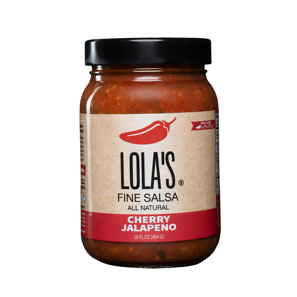 Lola's Cherry Jalapeño Salsa, a condiment in a jar with a label, featuring a fusion of cherries and hot sauce for a fresh, flavorful, and slightly spicy taste. 16 oz. glass jar.