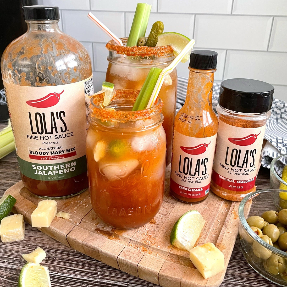 Lola's Original Seasoning: Bottles of smoky, sweet, and spicy hot sauce with a zesty lime twist, perfect for steaks, chicken, fish, and more!